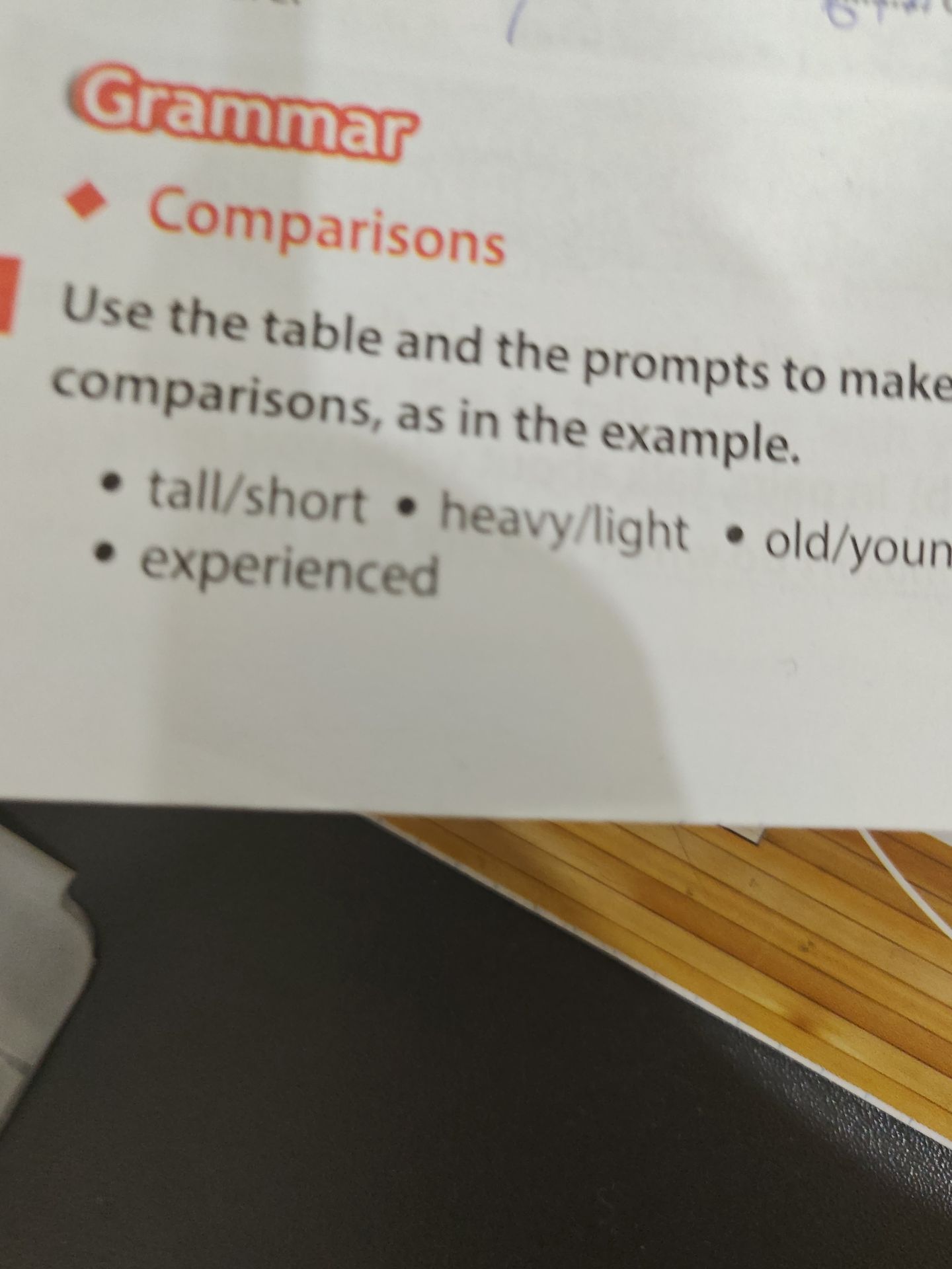 Фото задания: Use the table and the prompts to make comparisons, as in the example. • tall/short • heavy/light • old/young • experienced