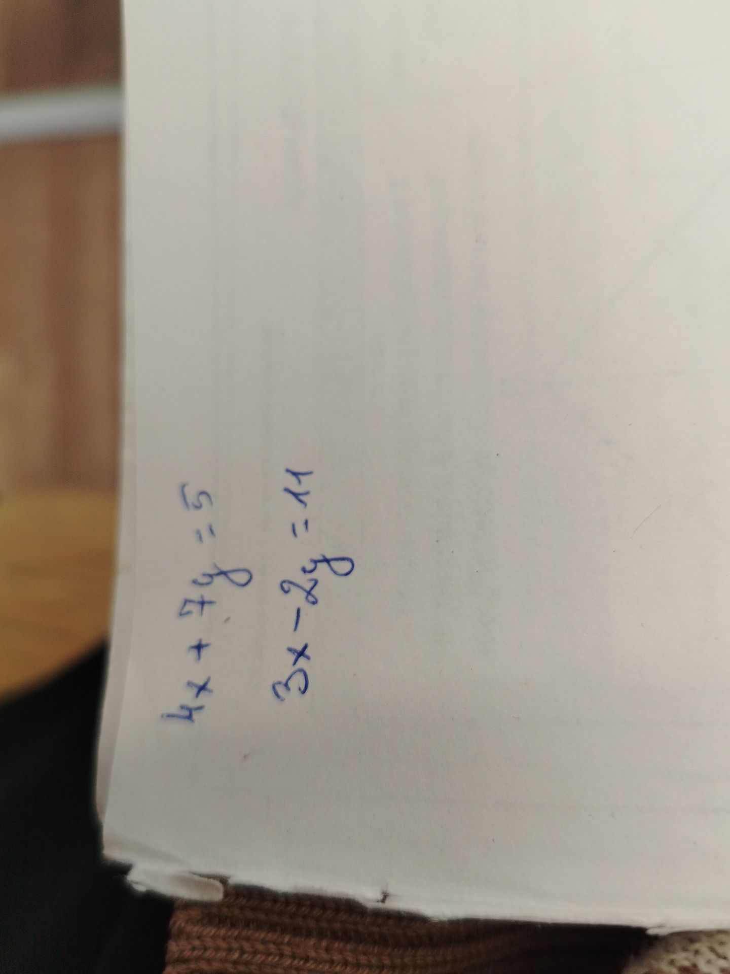 Фото задания: Solve the system of equations: 4x + 7y = 5 3x - 2y = 11