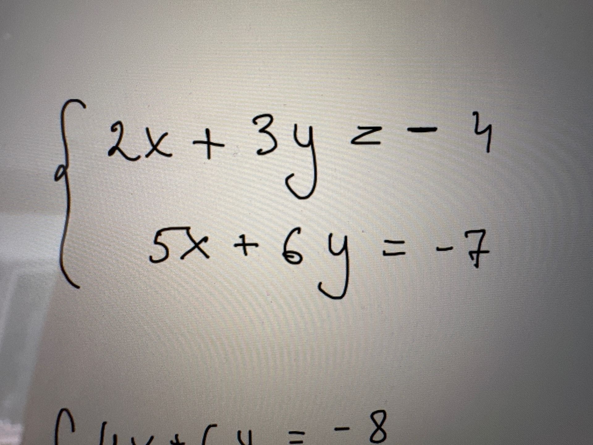 Фото задания: Solve the following system of equations: $$ \begin{cases} 2x + 3y = -4 \\ 5x + 6y = -7 \end{cases} $$