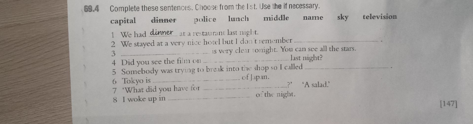 Фото задания: Complete these sentences. Choose from the list: capital, dinner, police, lunch, middle, name, sky, television.