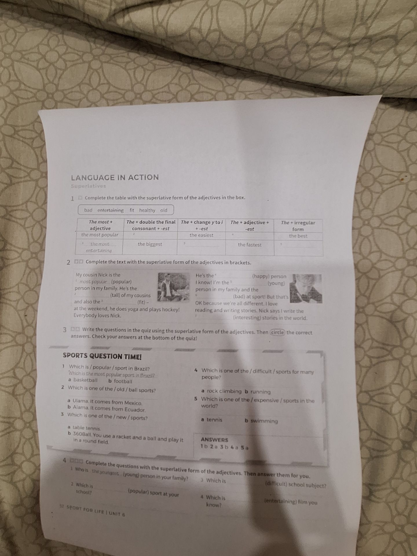 Фото задания: Complete exercises 1–4 on the photographed worksheet about superlatives.