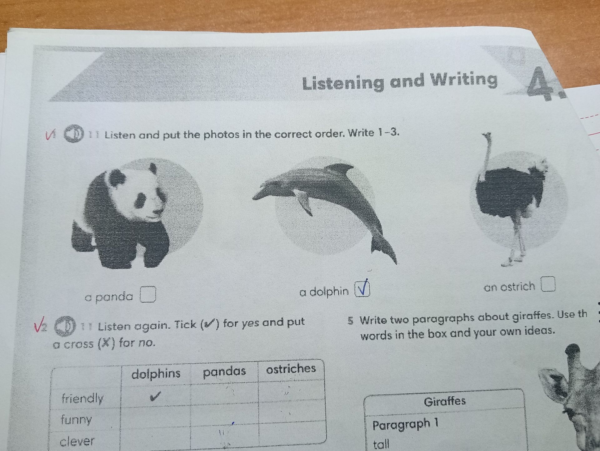 Фото задания: 2) Listen again. Tick (✓) for yes and put a cross (✗) for no. Complete the table for dolphins, pandas and ostriches using the…