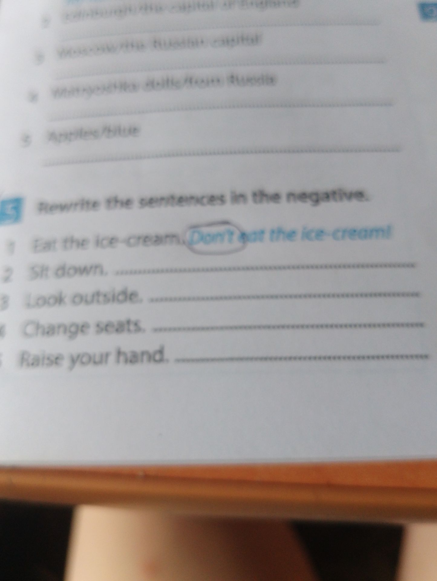 Фото задания: Rewrite the sentences in the negative. 1) Eat the ice-cream. 2) Sit down. 3) Look outside. 4) Change seats. 5) Raise your…