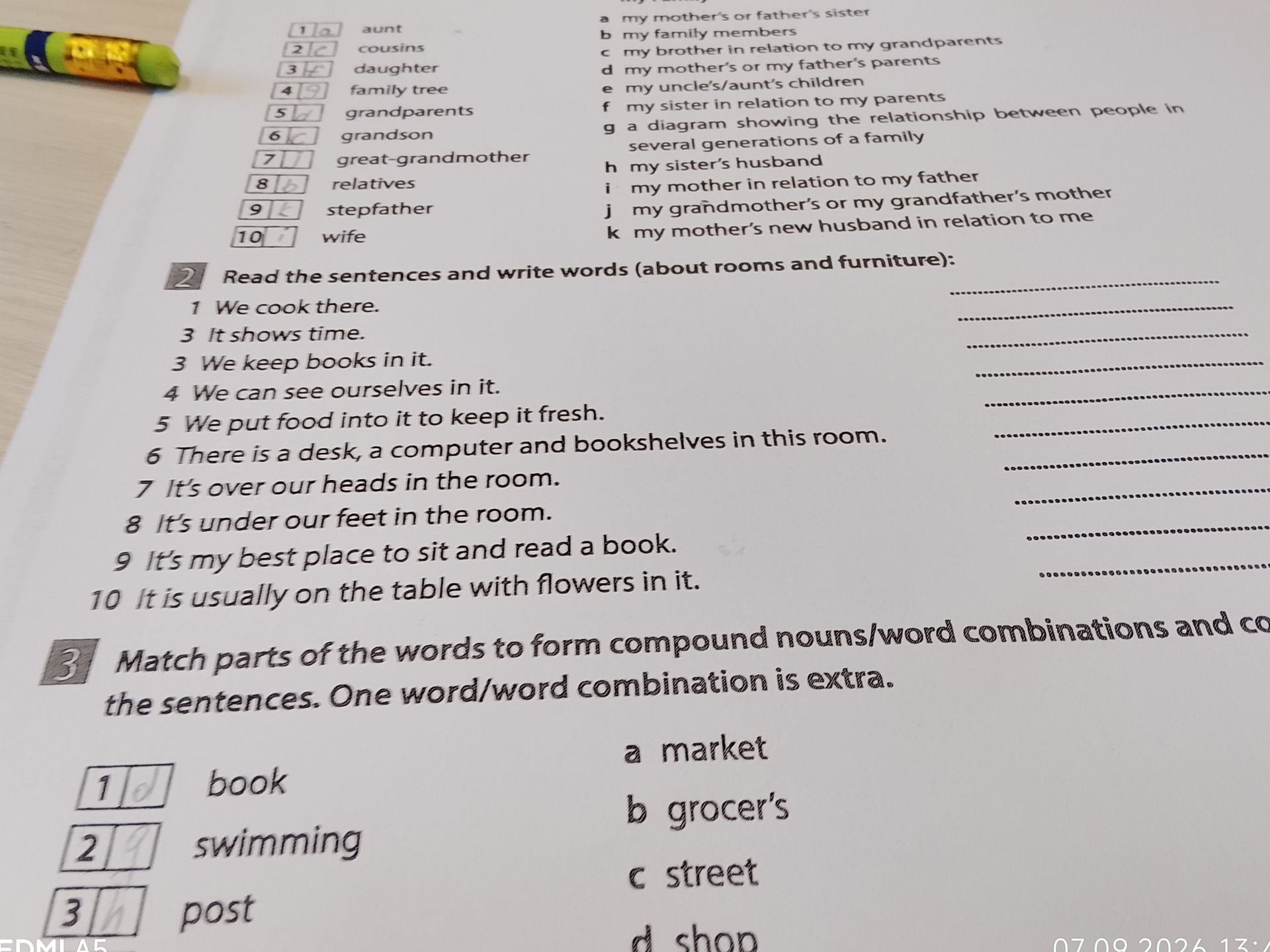 Фото задания: 2. Read the sentences and write words about rooms and furniture: 1 We cook there. 2 It shows time. 3 We keep books in it. 4…