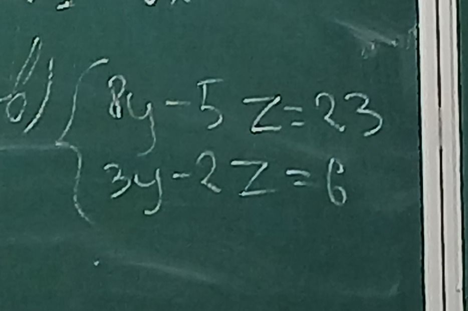 Фото задания: Решить систему уравнений: \(\begin{cases}8y-5z=23,\\3y-2z=6.\end{cases}\)