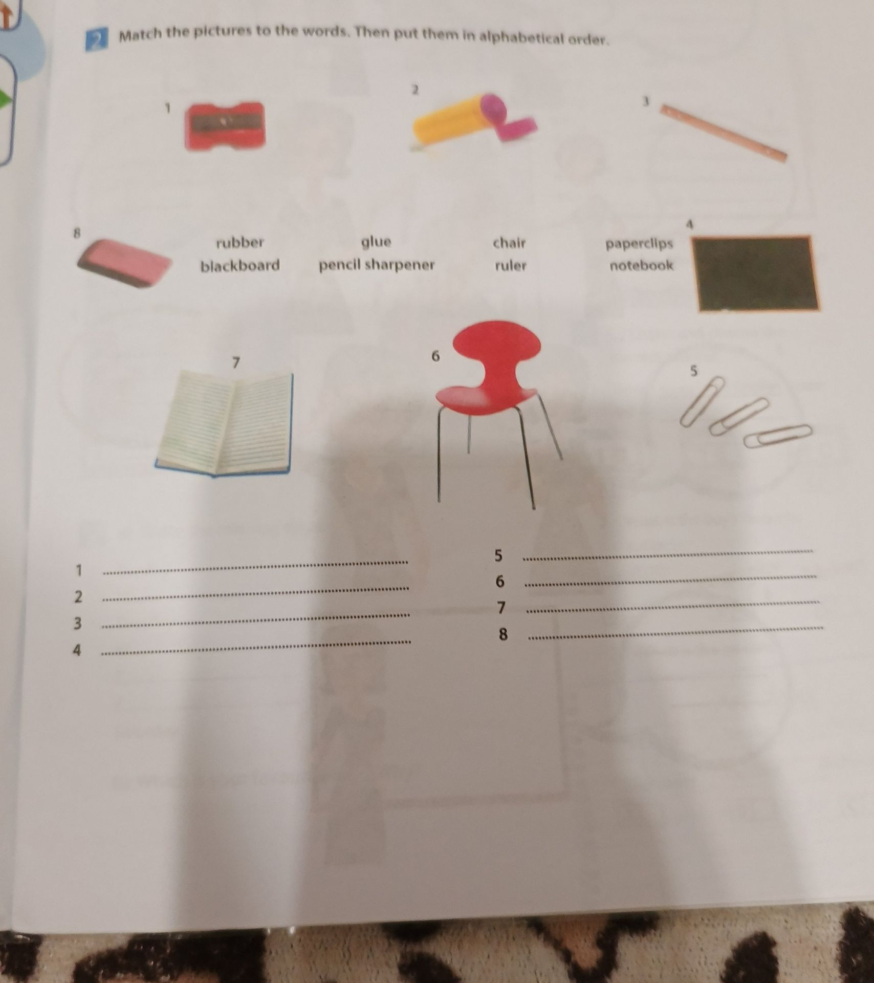 Фото задания: Match the pictures to the words. Then put them in alphabetical order. Words: rubber, glue, chair, blackboard, pencil…
