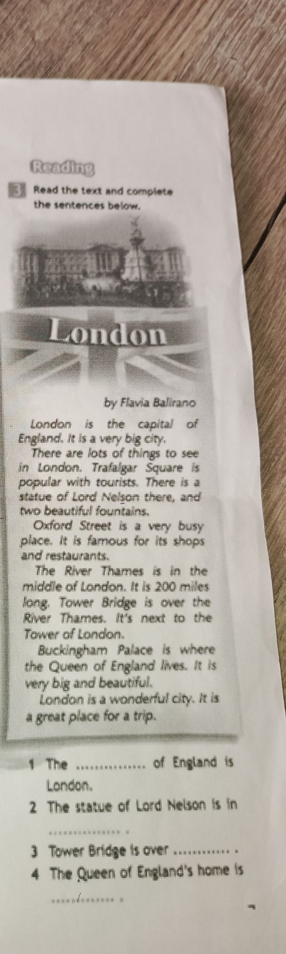 Фото задания: Read the text and complete the sentences below. 1. The ______ of England is London. 2. The statue of Lord Nelson is in…