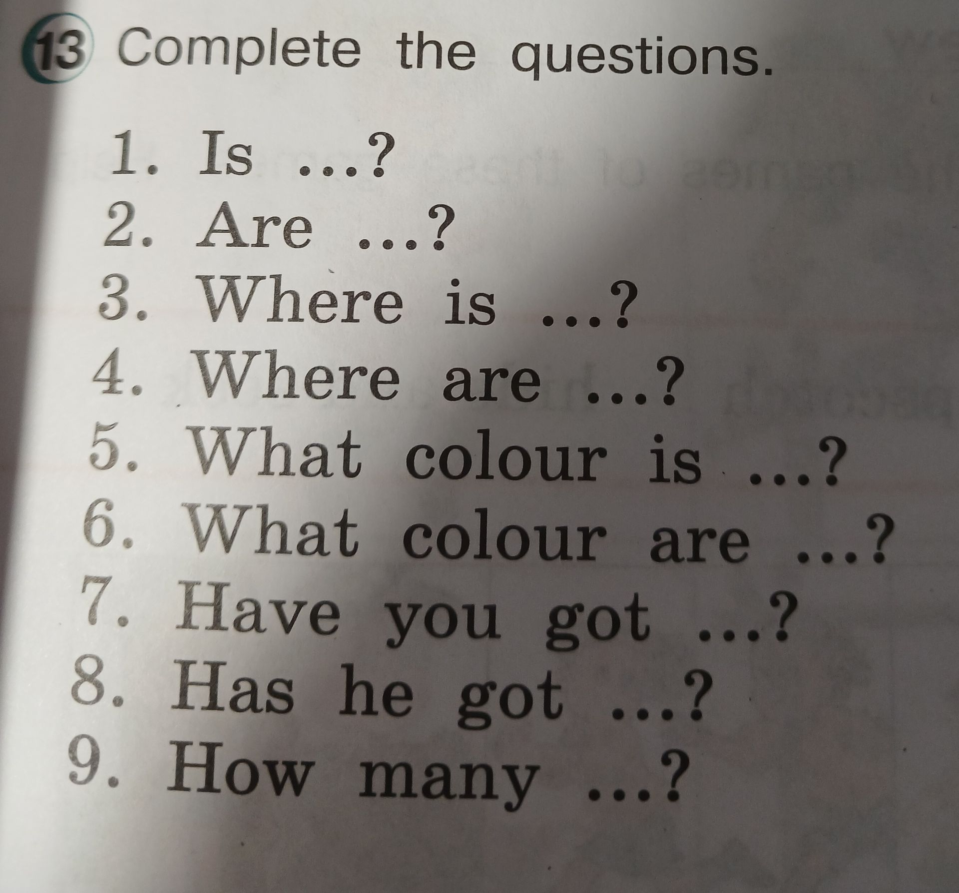 Фото задания: Complete the questions. 1. Is ...? 2. Are ...? 3. Where is ...? 4. Where are ...? 5. What colour is ...? 6. What colour are…