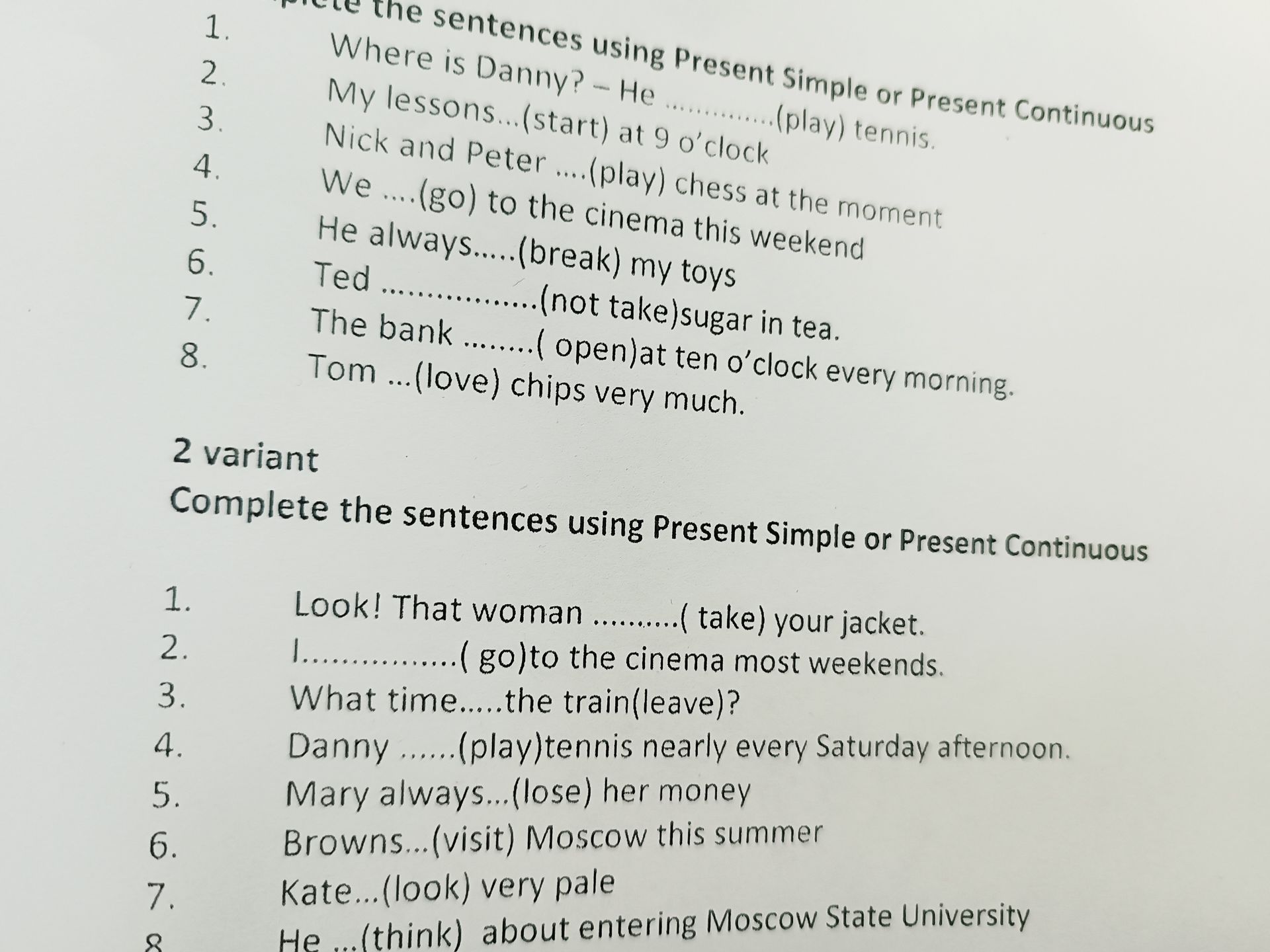 Фото задания: 2 variant. Complete the sentences using Present Simple or Present Continuous. 1. Look! That woman … (take) your jacket. 2.…