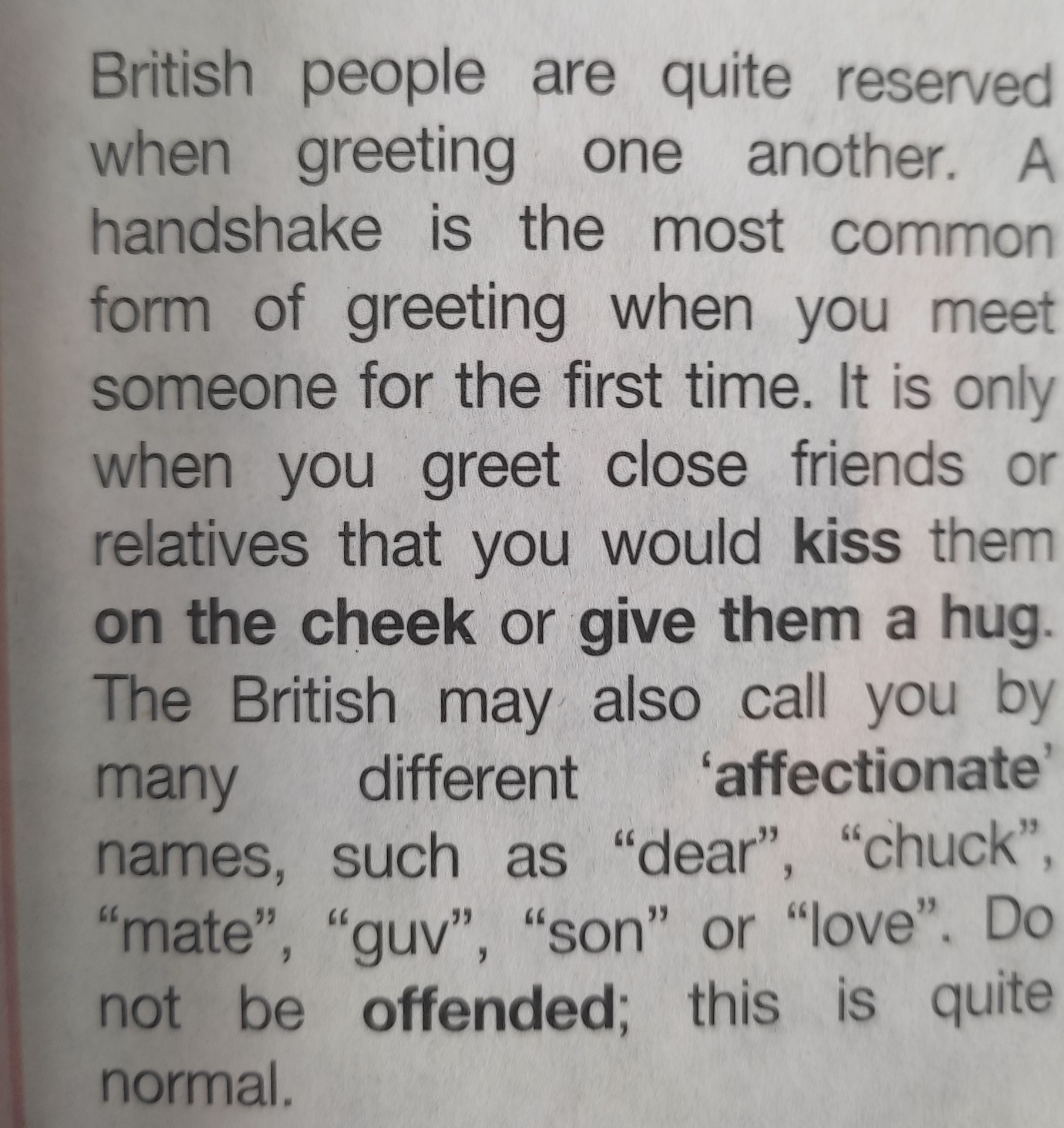 Фото задания: Текст на изображении: “British people are quite reserved when greeting one another. A handshake is the most common form of…
