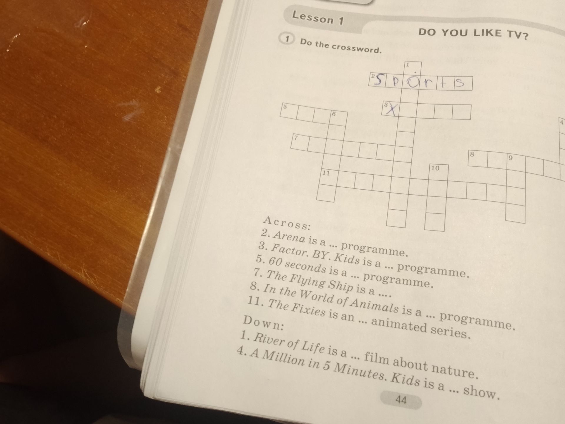 Фото задания: 1. Do the crossword. Across: 2. Arena is a ... programme. 3. Factor BY Kids is a ... programme. 5. 60 seconds is a ...…