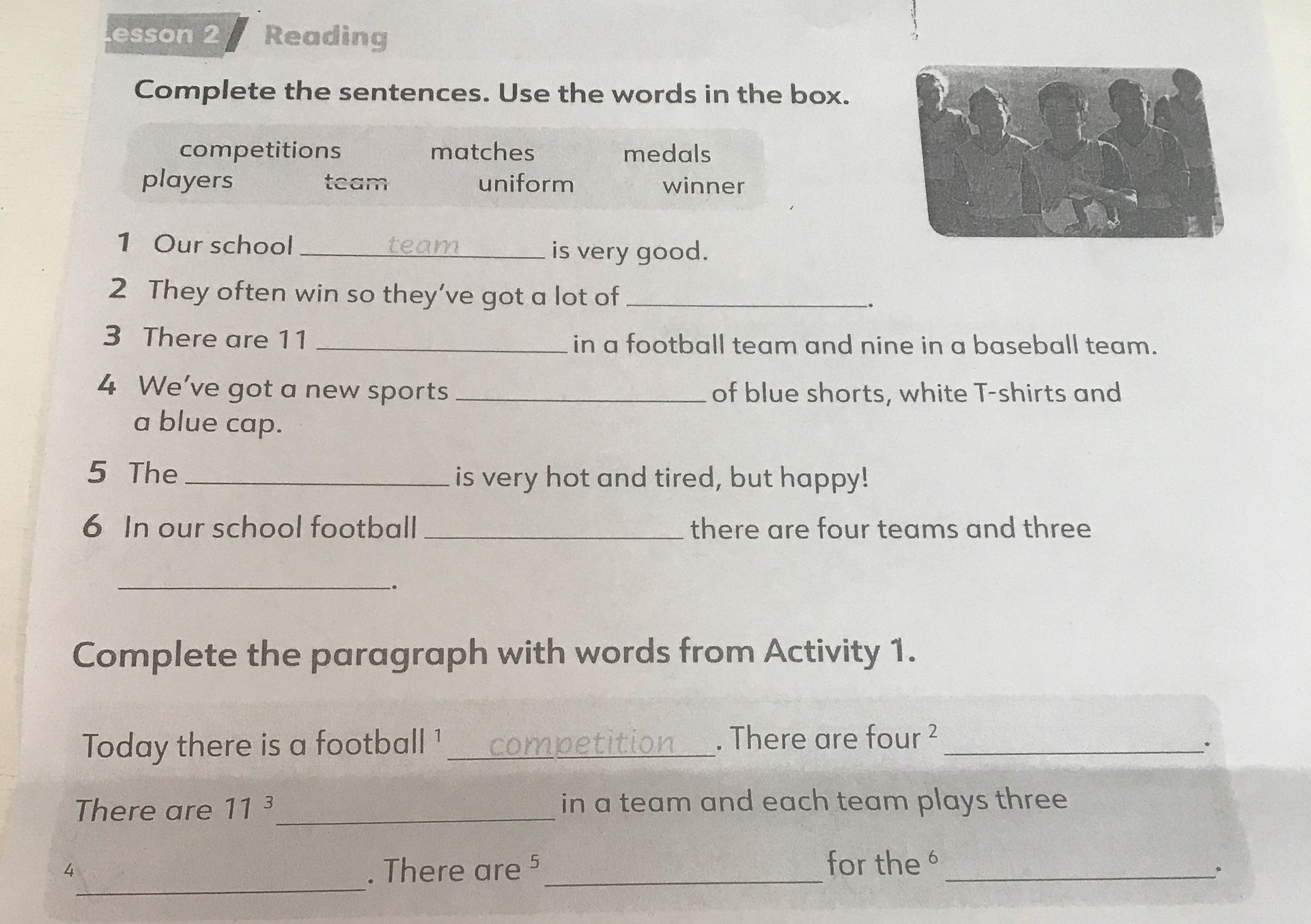 Фото задания: Complete the paragraph with words from Activity 1. Today there is a football 1 ___ . There are four 2 ___. There are 11 3 ___…