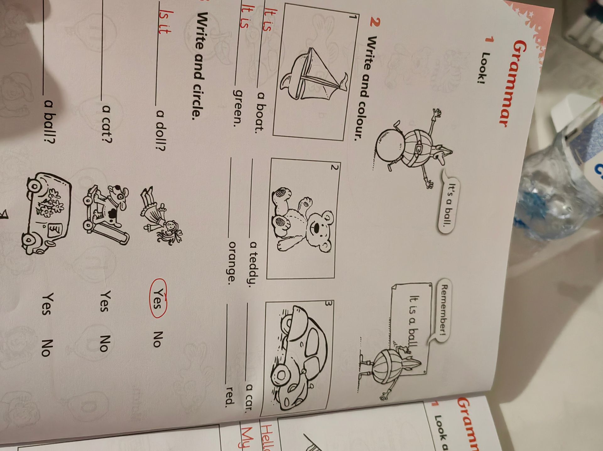 Фото задания: Write and circle. Is it a doll? Is it a cat? Is it a ball? Yes / No.