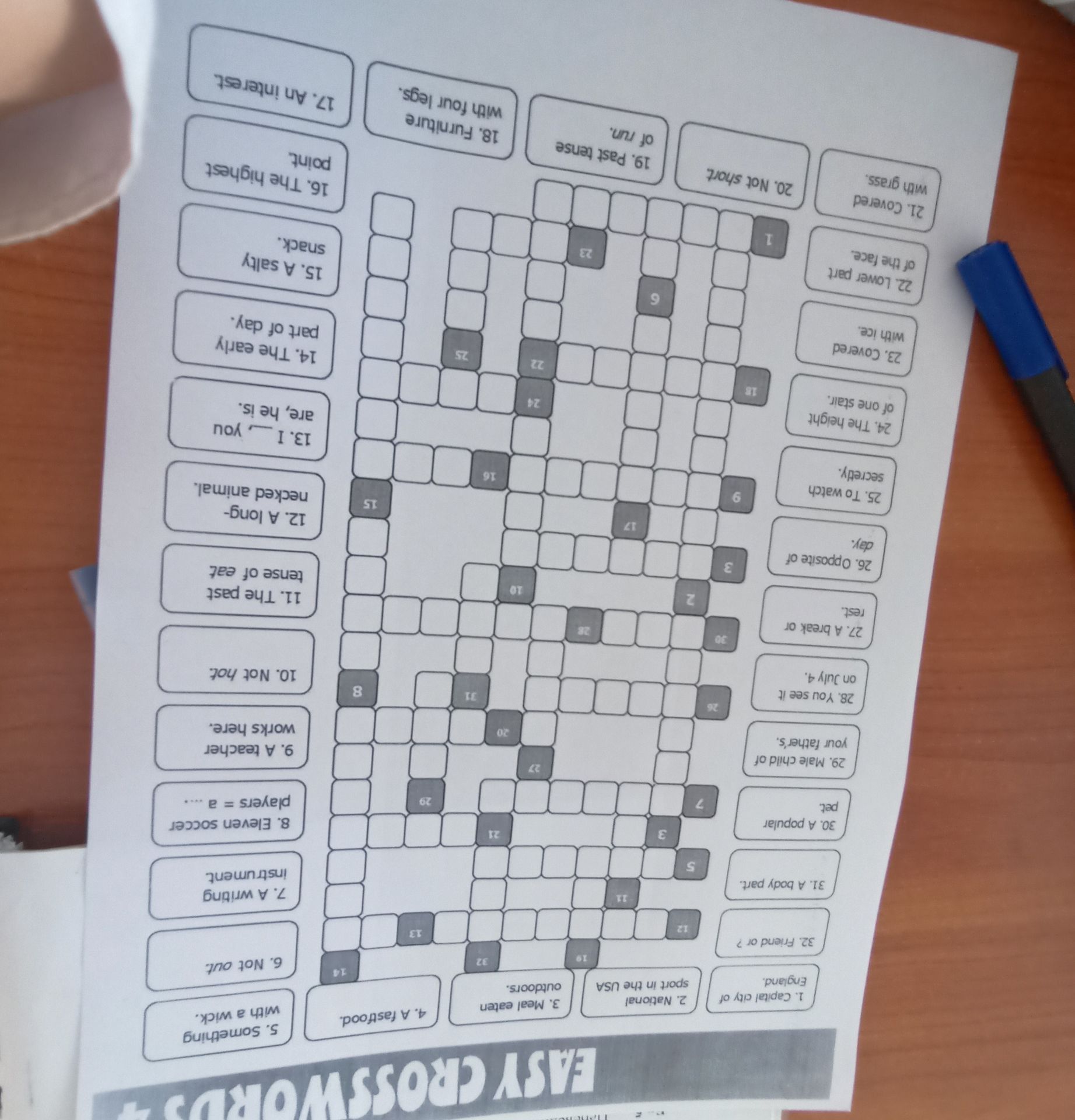 Фото задания: Easy crossword. 1. Capital city of England. 2. National sport in the USA. 3. Meal eaten outdoors. 4. A fast food. 5.…