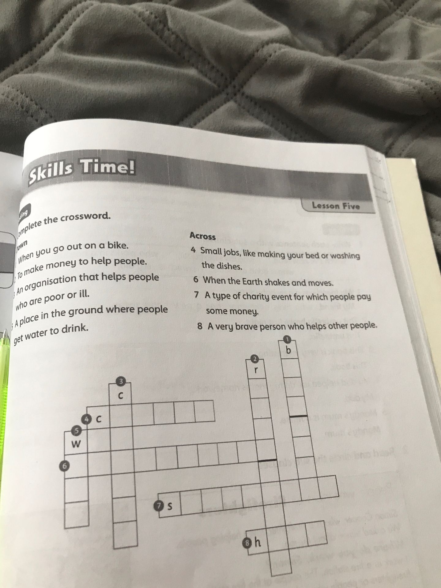 Фото задания: Complete the crossword. Down: 1 When you go out on a bike. 2 To make money to help people. 3 An organisation that helps…