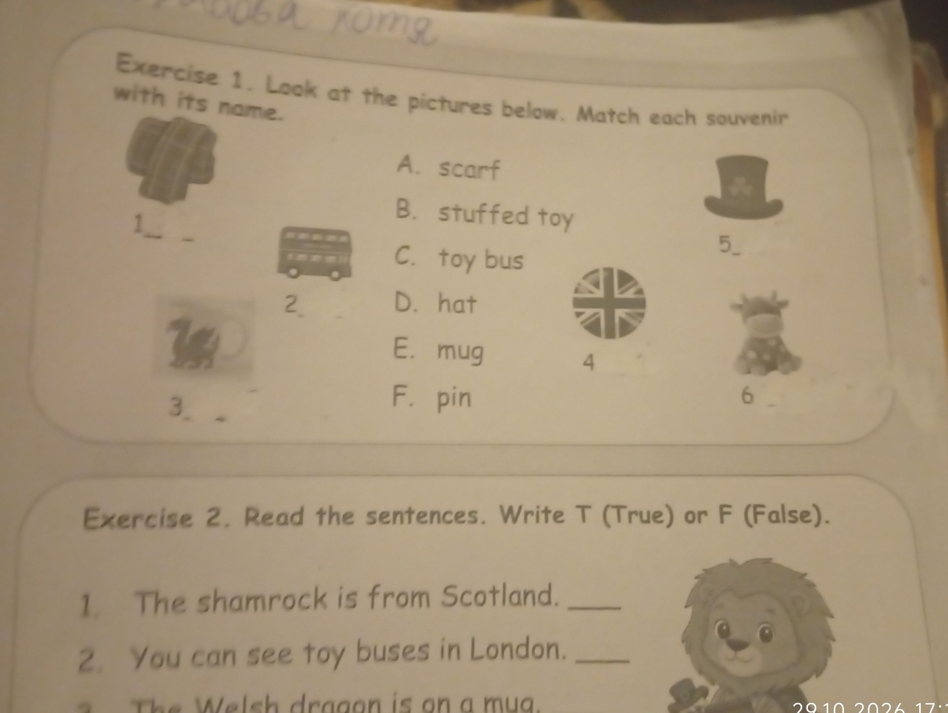 Фото задания: Exercise 1. Look at the pictures below. Match each souvenir with its name. A. scarf; B. stuffed toy; C. toy bus; D. hat; E.…