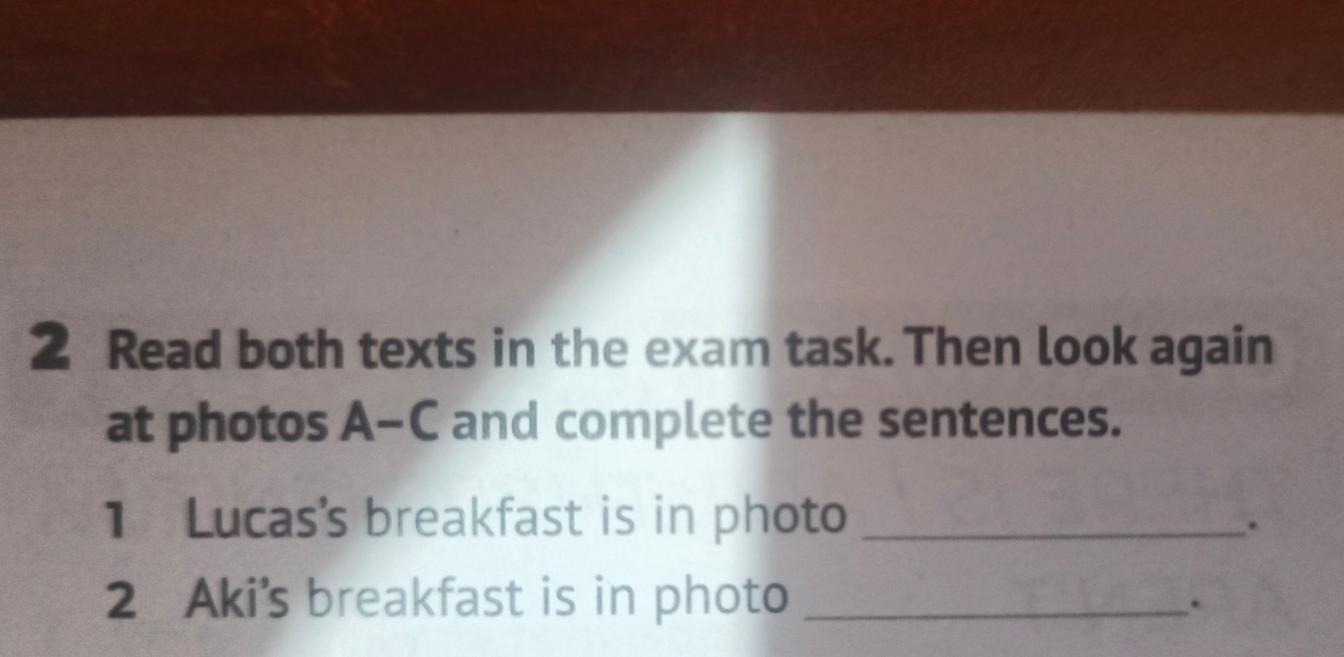 Фото задания: 2. Read both texts in the exam task. Then look again at photos A–C and complete the sentences. 1. Lucas’s breakfast is in…